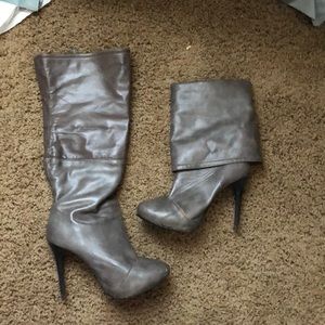 Grey heeled boots.